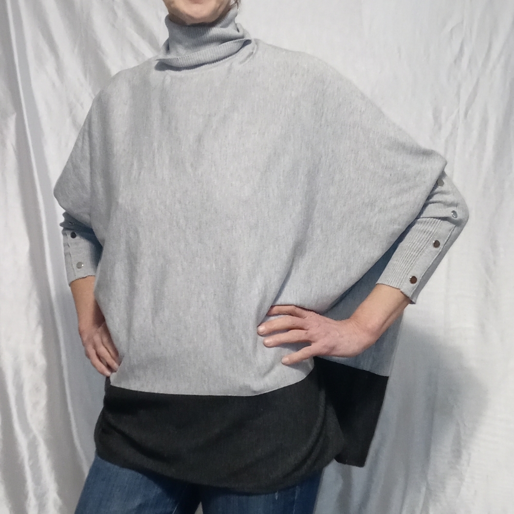 Joseph a gray and black poncho
